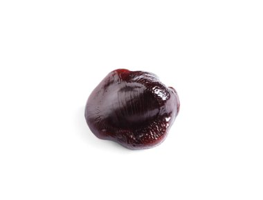 Beyaz arkaplanda bir kahverengi tamarind tohumu