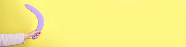 Woman Holding Boomerang Yellow Background Closeup — Stock Photo, Image