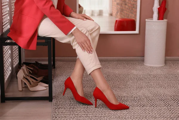 Woman Putting Stylish Shoes Hall Closeup Storage Idea — Stock Photo, Image