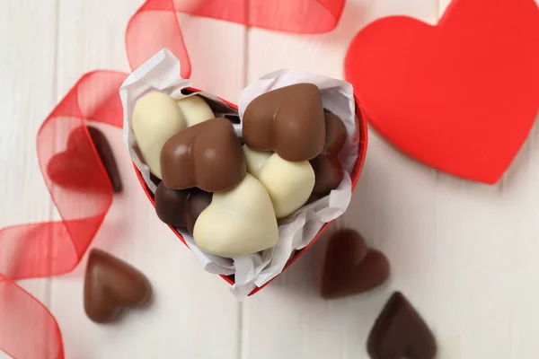 Beautiful Heart Shaped Chocolate Candies White Wooden Table Flat Lay — Stock Photo, Image