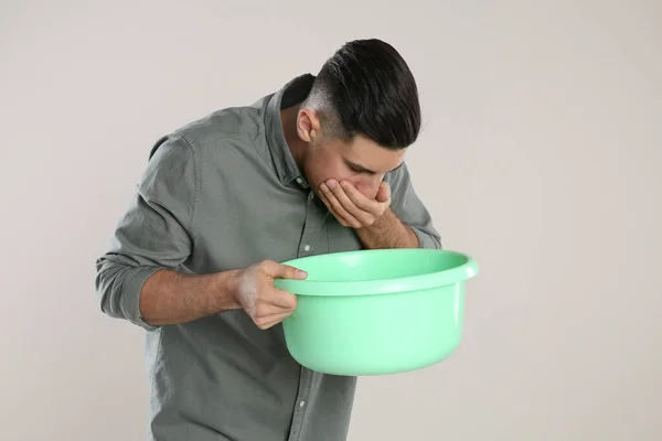 Man Basin Suffering Nausea Beige Background Food Poisoning — Stock Photo, Image