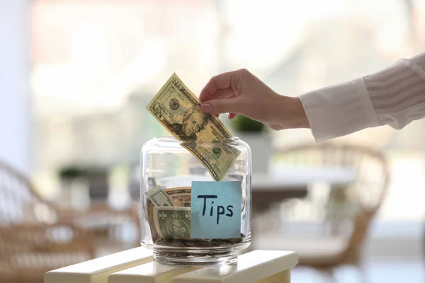 Woman Putting Tips Glass Jar Table Closeup — Stock Photo, Image