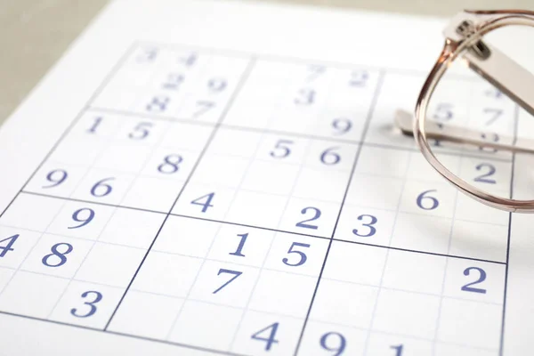 Sudoku Eyeglasses Table Closeup View — Stock Photo, Image