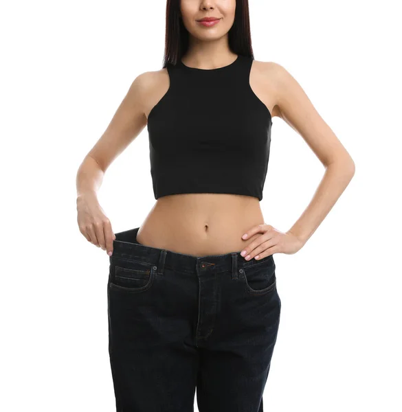 Jovem Mulher Vestindo Jeans Grandes Após Perda Peso Fundo Branco — Fotografia de Stock