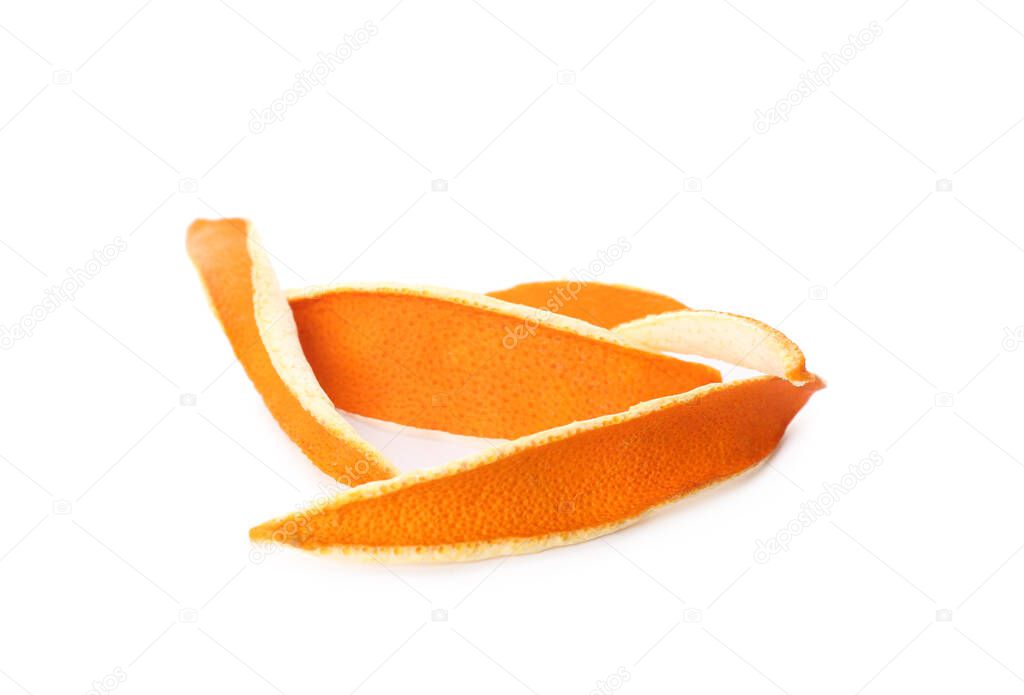 Pile of dry orange peels on white background