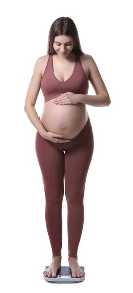 Mujer Embarazada Pie Sobre Escamas Sobre Fondo Blanco —  Fotos de Stock