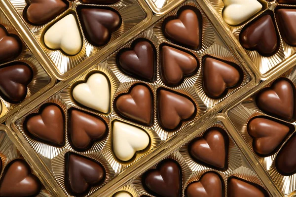 Mooie Hartvormige Chocolade Snoepjes Doos Als Achtergrond Bovenaanzicht — Stockfoto