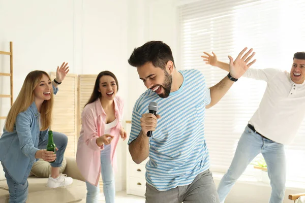 Young Man Singing Karaoke Friends Home — Stock Photo, Image