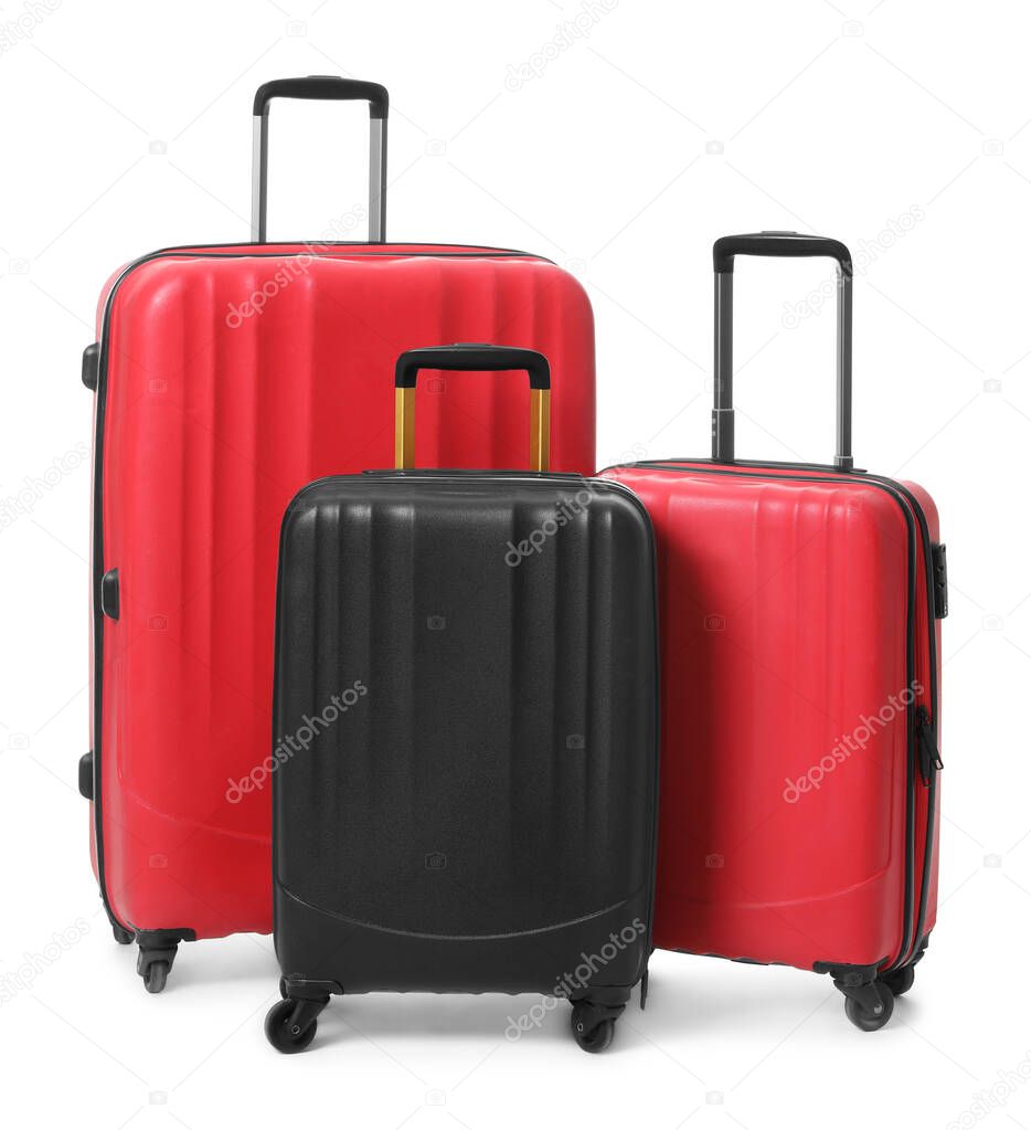 Modern suitcases for travelling on white background