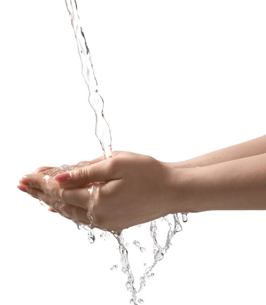 Pouring water into woman's hands on grey background, closeup