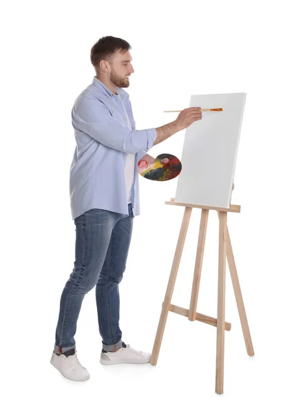 Hombre Pintando Con Pincel Sobre Caballete Sobre Fondo Blanco Joven —  Fotos de Stock
