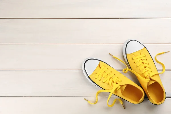 Pair Yellow Sneakers White Wooden Table Flat Lay Space Text — Stock Photo, Image