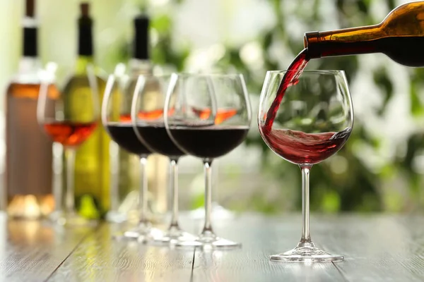 Pouring Red Wine Bottle Glass Wooden Table — Stock Photo, Image