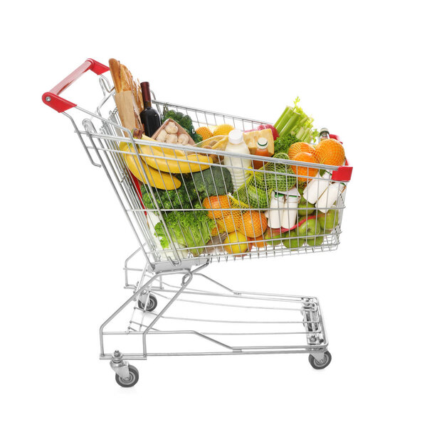 Shopping cart full of groceries on white background