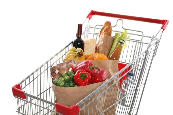 白い背景に食料品でいっぱいのショッピングカート — ストック写真