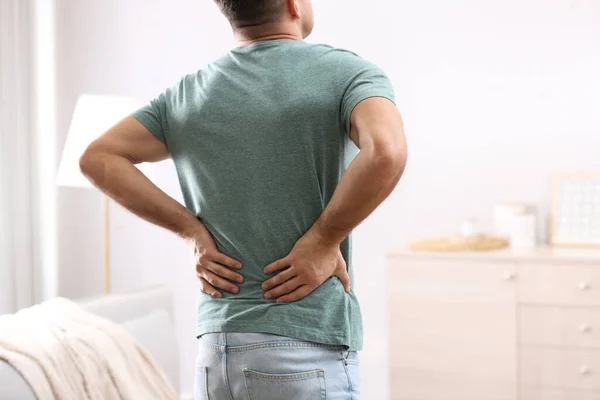 Man Suffering Back Pain Home Bad Posture Problem — Stock Photo, Image