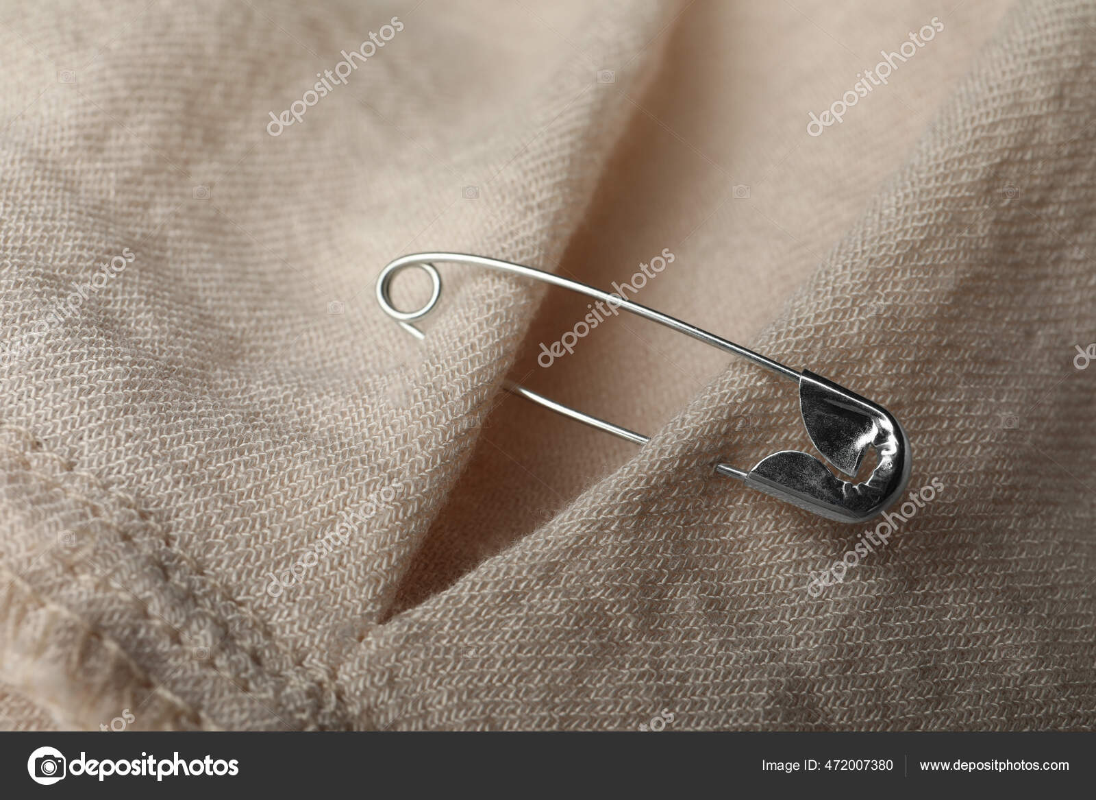 Closeup View Metal Safety Pin Clothing Stock Photo by ©NewAfrica 472007380