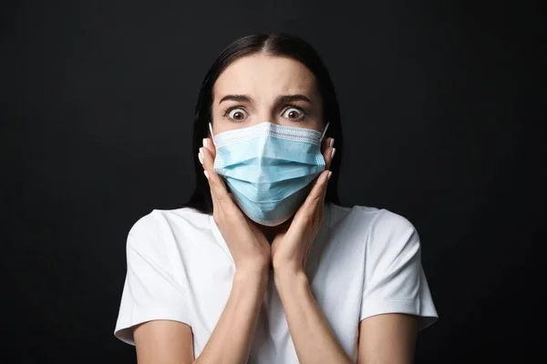 Young Woman Protective Mask Feeling Fear Black Background — Stock Photo, Image