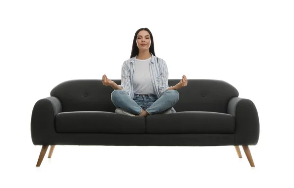 Young Woman Meditating Comfortable Grey Sofa White Background — Stock Photo, Image