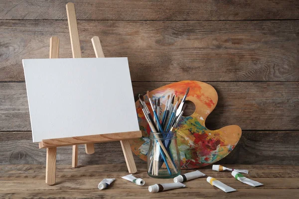 Easel Blank Canvas Painting Palette Brushes Isolated White Stock Vector by  ©lukpedclub.gmail.com 215082764