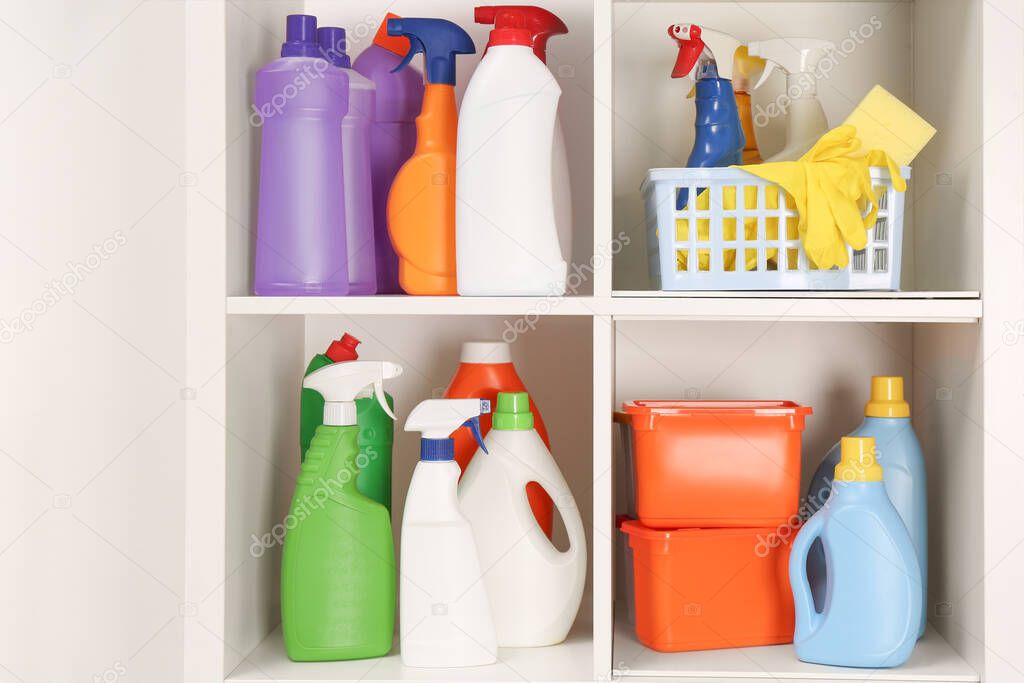 Different cleaning supplies and tools on shelves