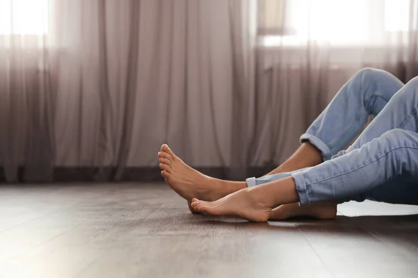 Barefoot Couple Sitting Warm Floor Home Closeup View Space Text — Stock Photo, Image