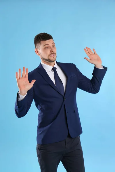 Man Suit Avoiding Something Light Blue Background — Stock Photo, Image