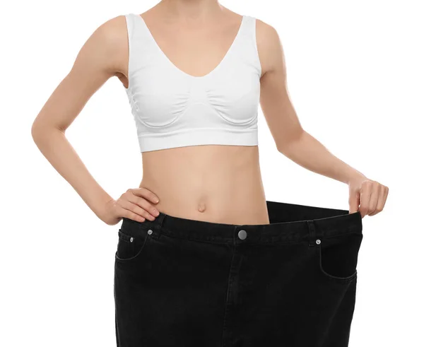 Junge Frau Trägt Große Jeans Nach Gewichtsverlust Auf Weißem Hintergrund — Stockfoto