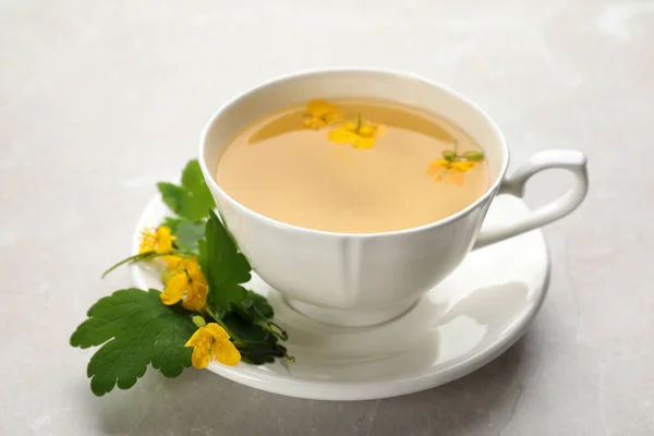 Cup Aromatic Celandine Tea Flowers Grey Table Closeup — Stock Photo, Image