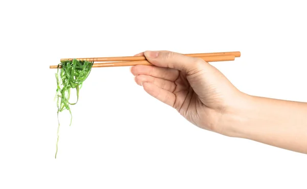 Mulher Segurando Pauzinhos Com Salada Algas Japonesas Isolada Branco Close — Fotografia de Stock