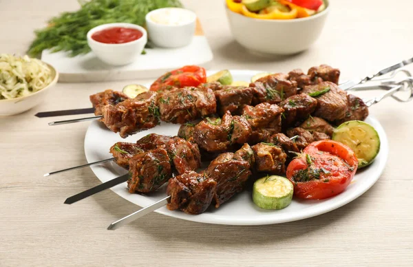 Metal Skewers Delicious Meat Vegetables Served White Wooden Table — Stock Photo, Image