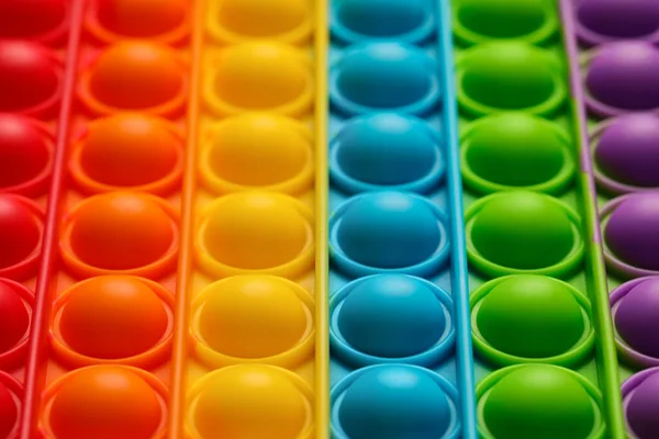 Rainbow Pop Fidget Toy Background Closeup — Stock fotografie