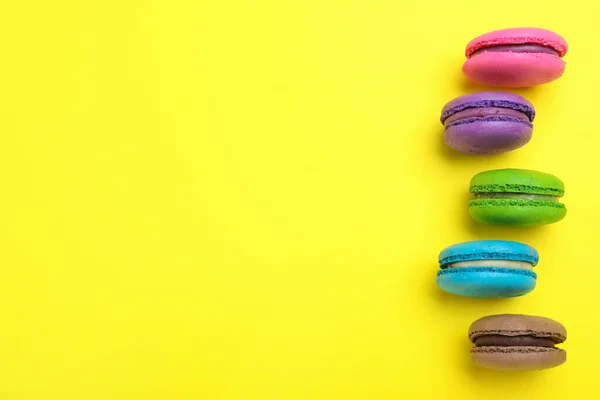 Delicious Colorful Macarons Yellow Background Flat Lay Space Text — Stock Photo, Image