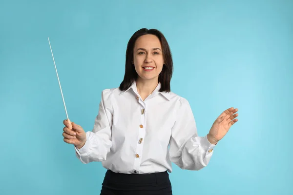 Music Teacher Baton Turquoise Background — Stock Photo, Image