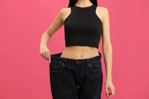 Young Woman Wearing Big Jeans Weight Loss Pink Background Closeup — Stock Photo, Image