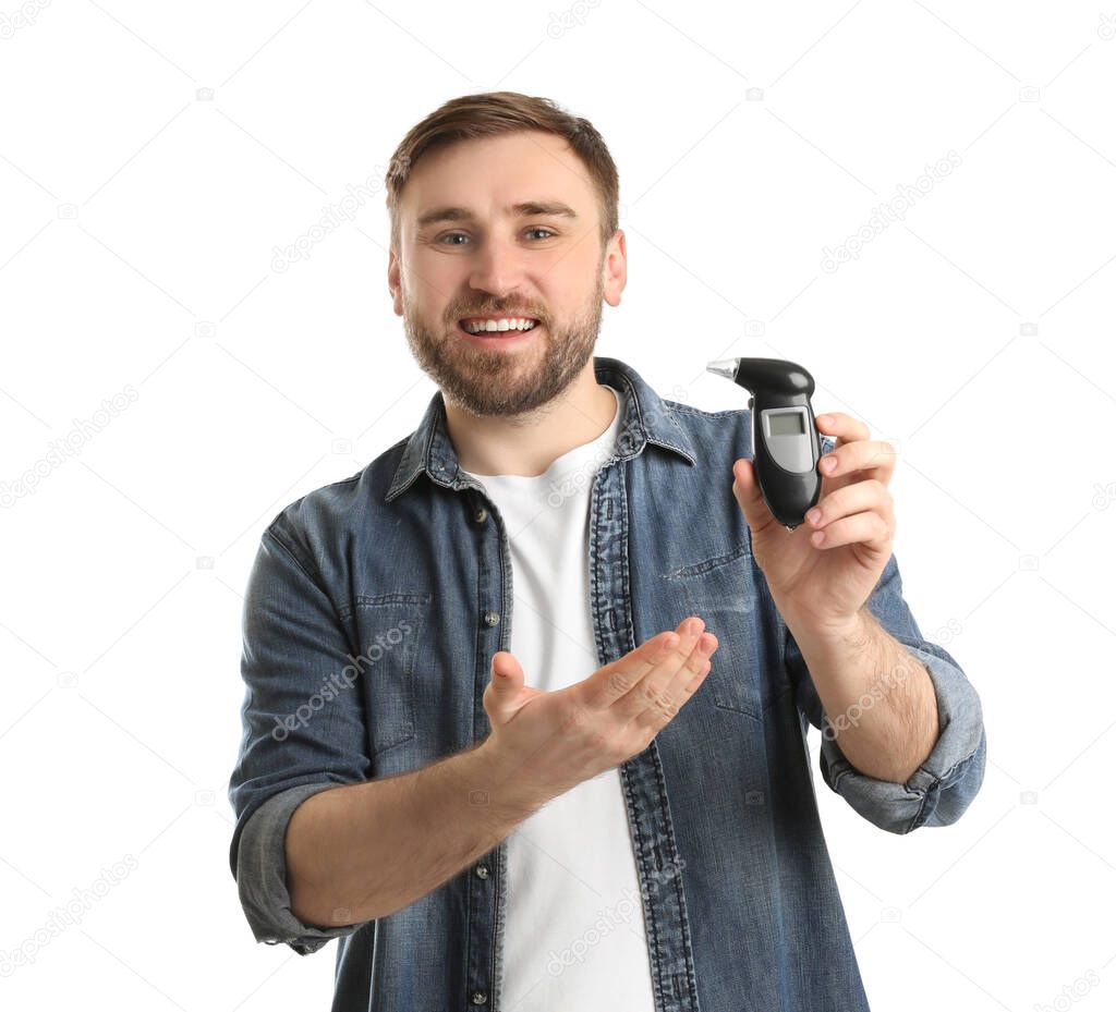 Happy man with breathalyzer on white background