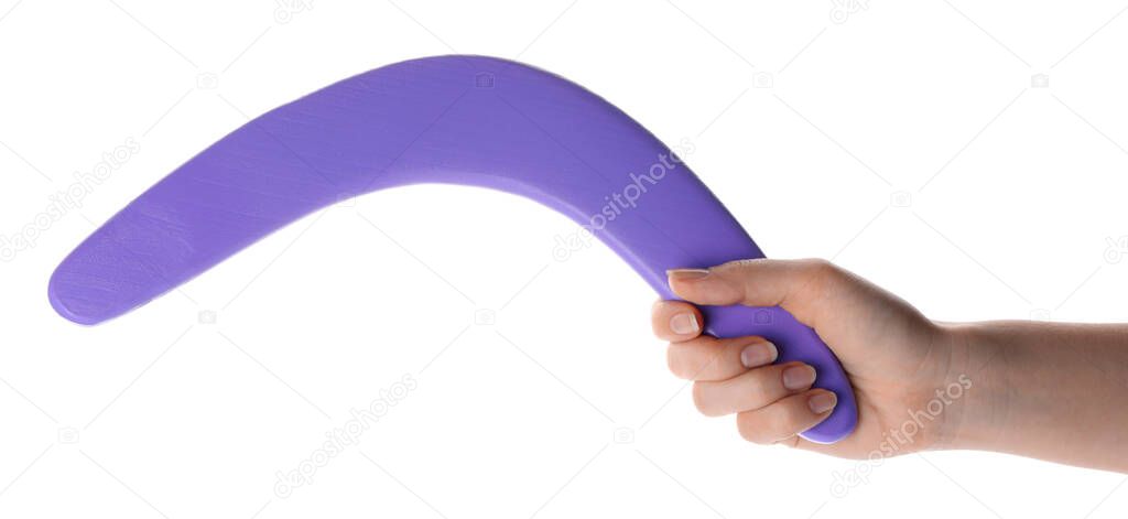 Woman holding purple boomerang on white background, closeup