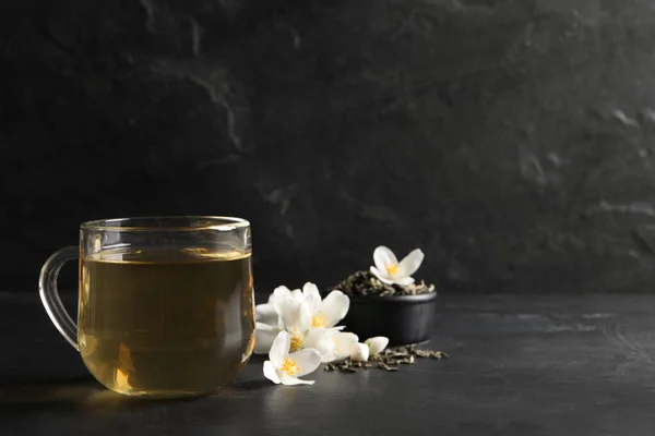 Glass Cup Jasmine Tea Fresh Flowers Black Table Space Text — Stock Photo, Image