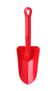 Beyaz üzerine izole edilmiş kırmızı plastik bir kürek.