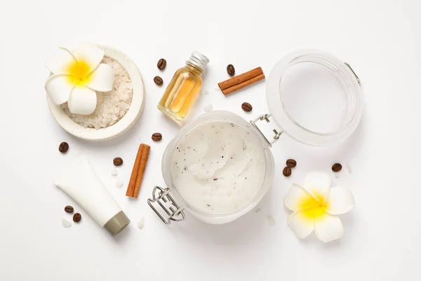 Composition with body scrub on white background, top view