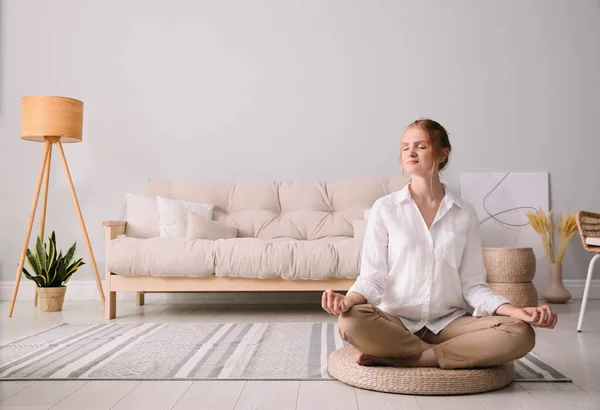 stock image Woman meditating on wicker mat at home. Space for text