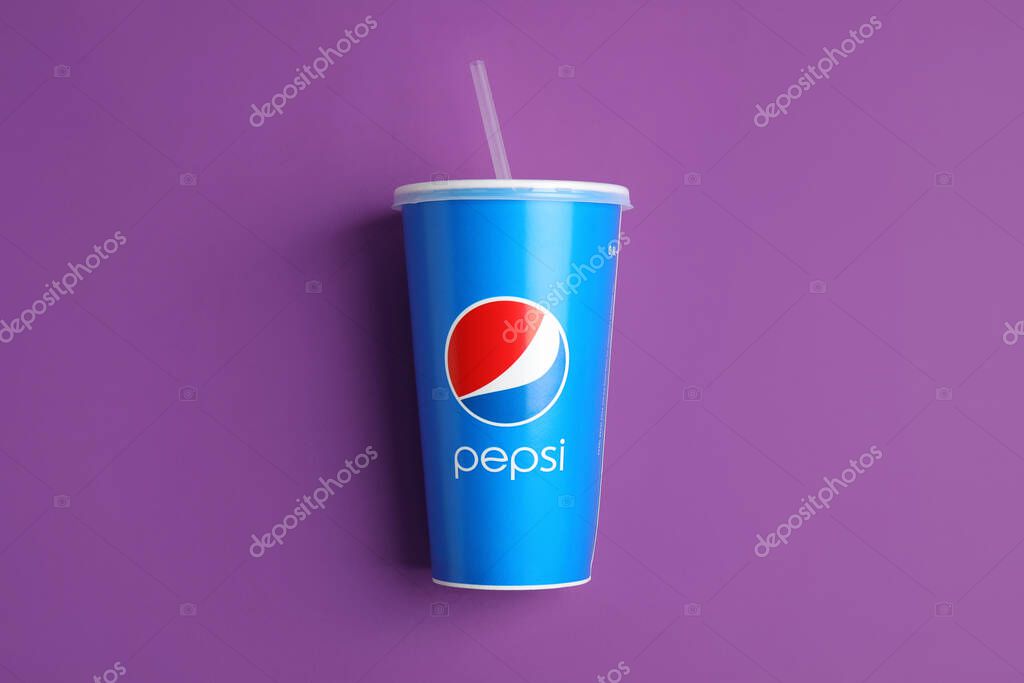 MYKOLAIV, UKRAINE - JUNE 9, 2021: Paper Pepsi cup on purple background, top view
