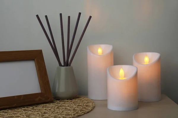 Glowing Decorative Led Candles Wooden Table Indoors — Stock Photo, Image