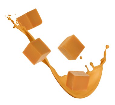 Lezzetli karamel küpleri ve beyaz arka planda uçuşan sos