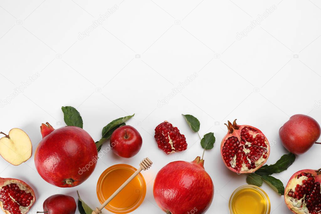 Flat lay composition with Rosh Hashanah holiday attributes on white background. Space for text