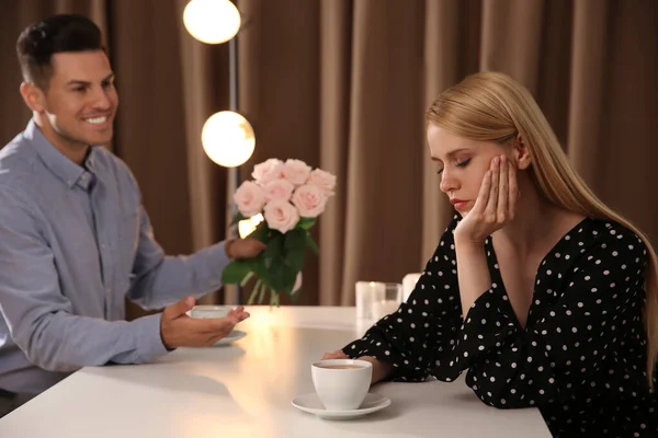 Man Giving Flowers Displeased Young Woman Restaurant Failed First Date — Stock Photo, Image