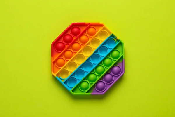 Rainbow Pop Fidget Toy Light Green Background Top View — Stock Photo, Image