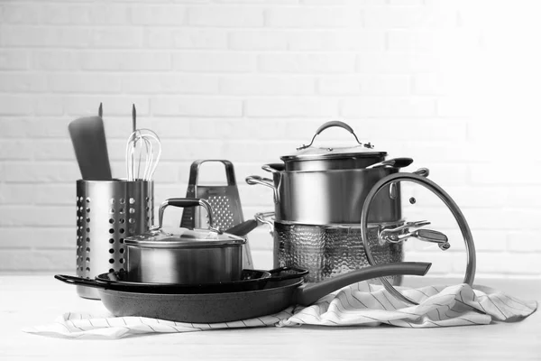 Set Clean Kitchenware White Table Brick Wall — Stock Photo, Image