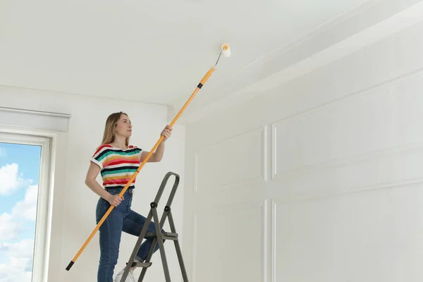 Young Woman Painting Ceiling White Dye Indoors Space Text — Stock Photo, Image