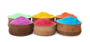 Colorful powder dyes in bowls on white background. Holi festival clipart